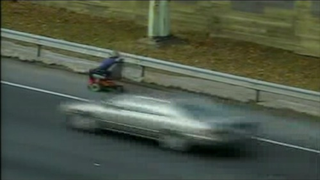 Watch An Electric Wheelchair Rider Take The Freeway Exit